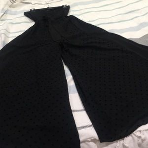 Sleeveless black jumpsuit polka dots